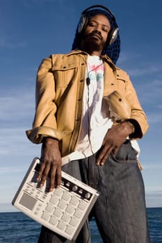 Low angle view of a mid adult man listening to music