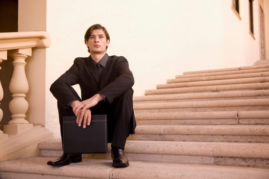 Businessman sitting on a staircase, Biltmore Hotel, Coral Gables, Florida, USA