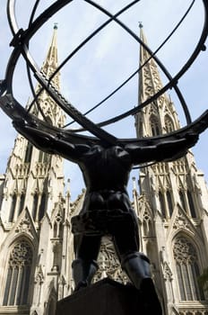 Low angle view of a statue in front of a cathedral, St. PatrickŽs Cathedral, Manhattan, New York City, New York State, USA