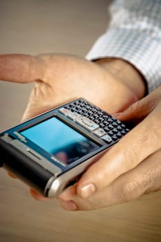 Close_up of a personŽs hand holding a smart phone