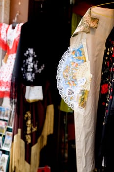 Close_up of a folding fan hanging on a clothing store, Madrid, Spain
