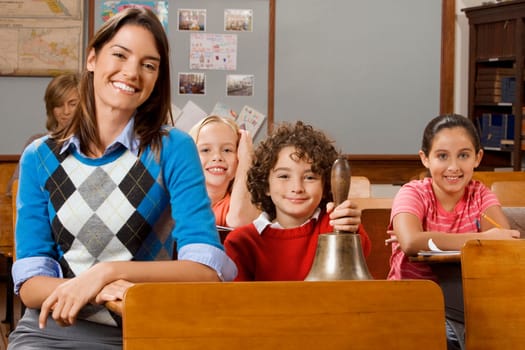Students with their teacher in a classroom