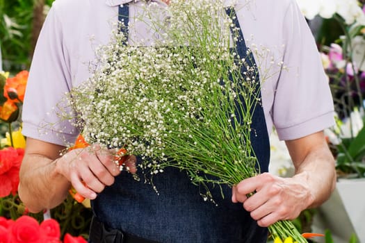 Florist making a bouquet of flowers