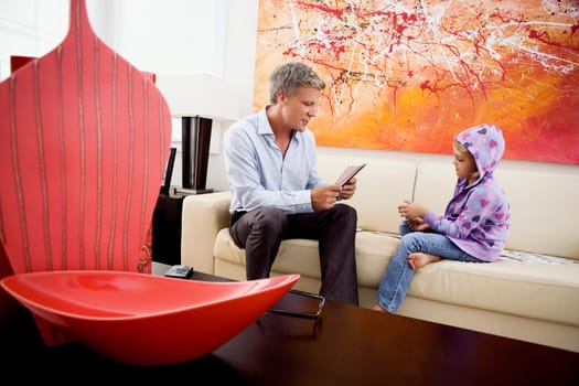Man playing cards with his daughter