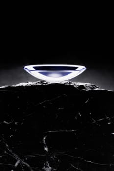 Close_up of a contact lens on a rock