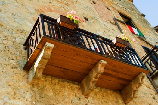 Low angle view of window boxes at a balcony, San Gimignano, Siena Province, Tuscany, Italy