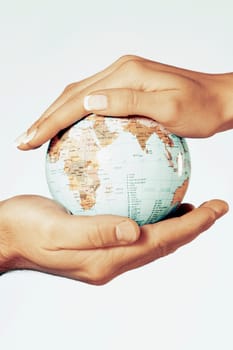 Close_up of a coupleŽs hands holding a globe