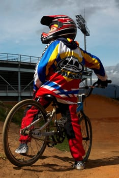 Rear view of a BMX cyclist performing