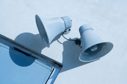 Low angle view of two megaphones on the wall