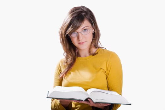 Portrait of a teenage girl reading a book