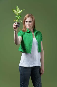 Woman looking at a seedling