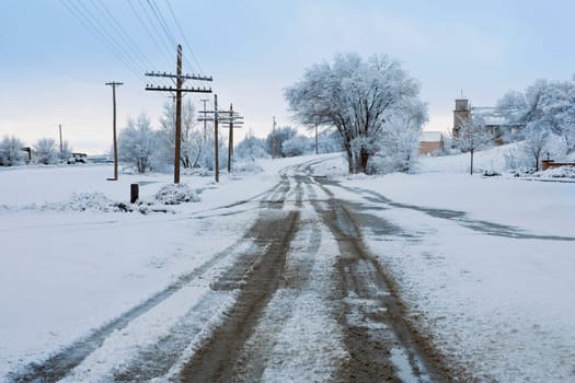 Road passing through a snow covered landscape