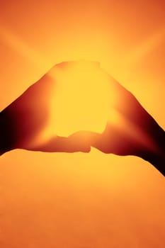 Sunlight shining through a finger frame