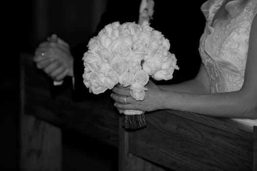 Newlywed couple standing in a church