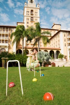 Woman playing croquet in a hotel lawn, Biltmore Hotel, Coral Gables, Florida, USA