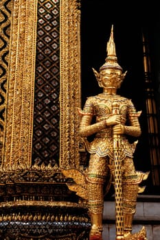 Statue in front of a temple, Wat Phra Kaeo, Grand Palace, Bangkok, Thailand