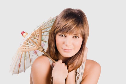 Portrait of a young woman holding a parasol