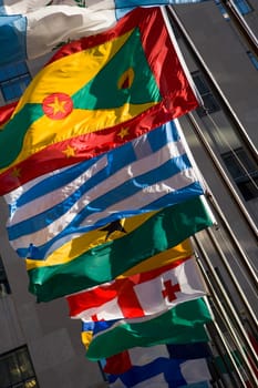 Low angle view of flags fluttering in a row, New York City, New York State, USA