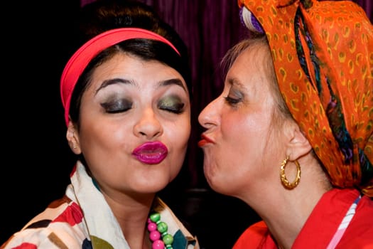 Close_up of a mature woman kissing her daughter