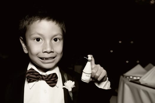 Portrait of a boy holding a spray bottle