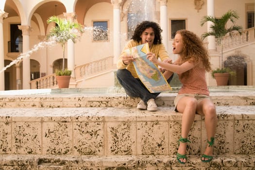 Couple looking at a map, Biltmore Hotel, Coral Gables, Florida, USA