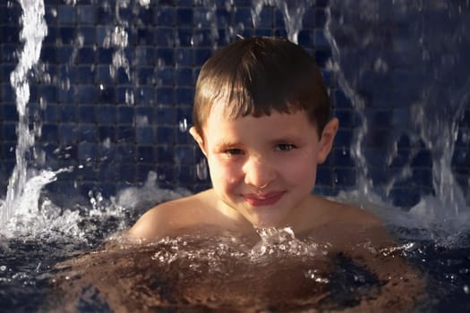 Portrait of a boy in a swimming pool