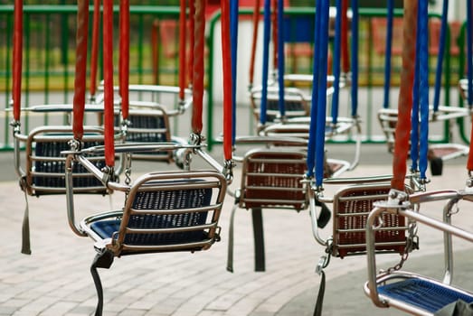 Hanging chairs in an amusement park ride