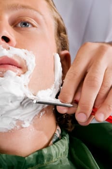 Man getting shaved in a salon