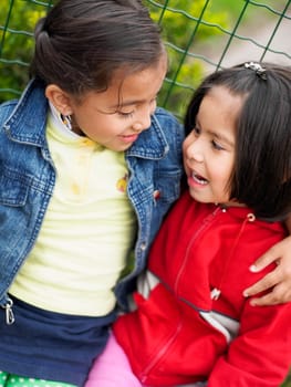 Close_up of two girls looking at each other