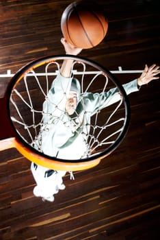 High angle view of a basketball player shooting a goal