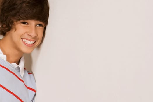 Close_up of a teenage boy smiling
