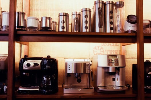 Coffee makers and containers on a rack