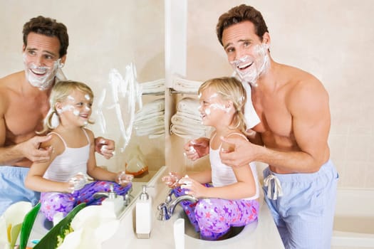 Man playing with his daughter in the bathroom