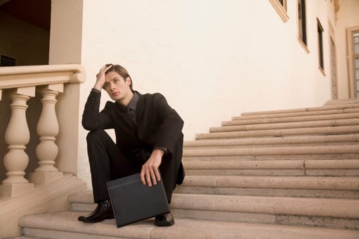 Businessman sitting on a staircase, Biltmore Hotel, Coral Gables, Florida, USA