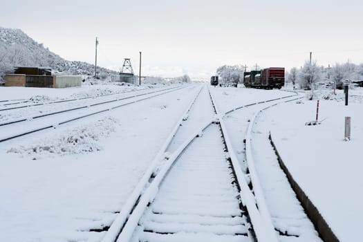 Railroad tracks covered with snow