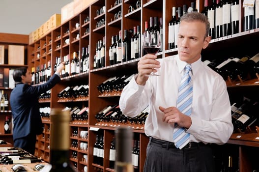 Businessman holding a wine glass