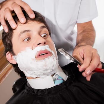 Man getting shaved in a salon