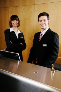 Portrait of two receptionists at the hotel reception