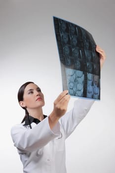 Female doctor examining an x_ray report