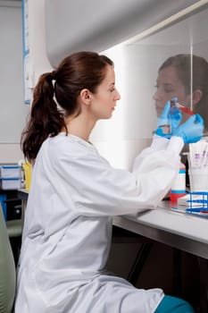 Female doctor holding a medical sample in a laboratory