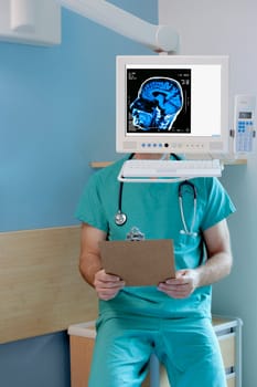 MRI scan of brain on a computer screen with a surgeon sitting behind it