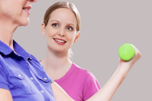 Physiotherapist assisting a patient in exercising