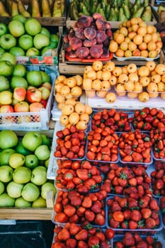 Fresh fruit in the market. Apricots, peaches, cherries, apples