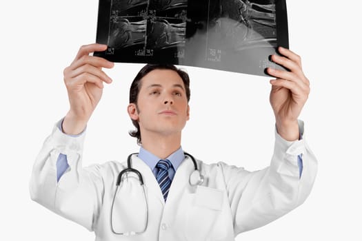 Doctor examining an x_ray report
