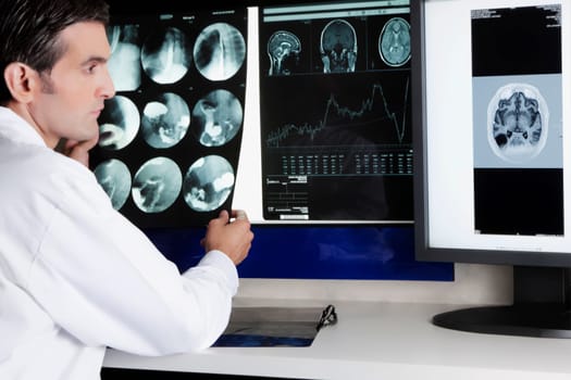 Doctor examining MRI report