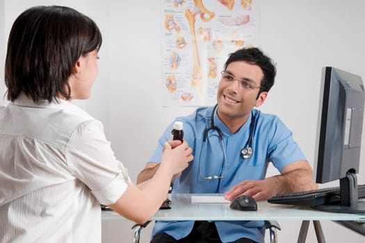 Doctor giving medicine to a patient