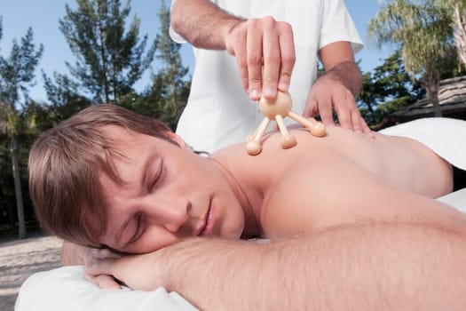 Man receiving acupressure treatment