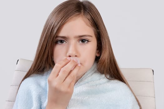 Portrait of a girl taking medicine
