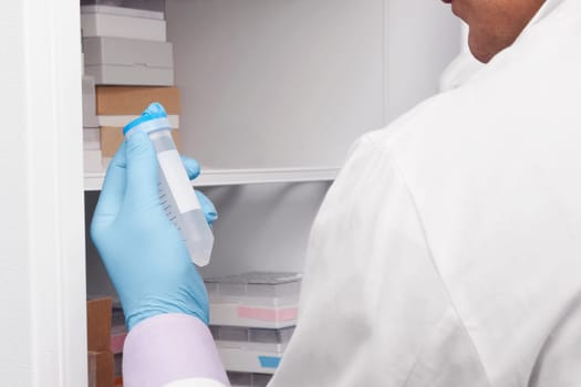 Doctor holding a medical sample in a laboratory