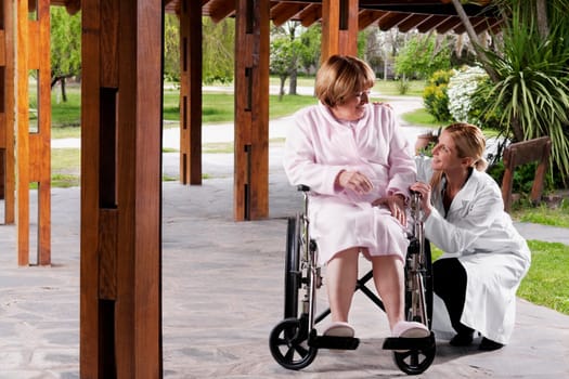 Doctor sitting near a patient and smiling